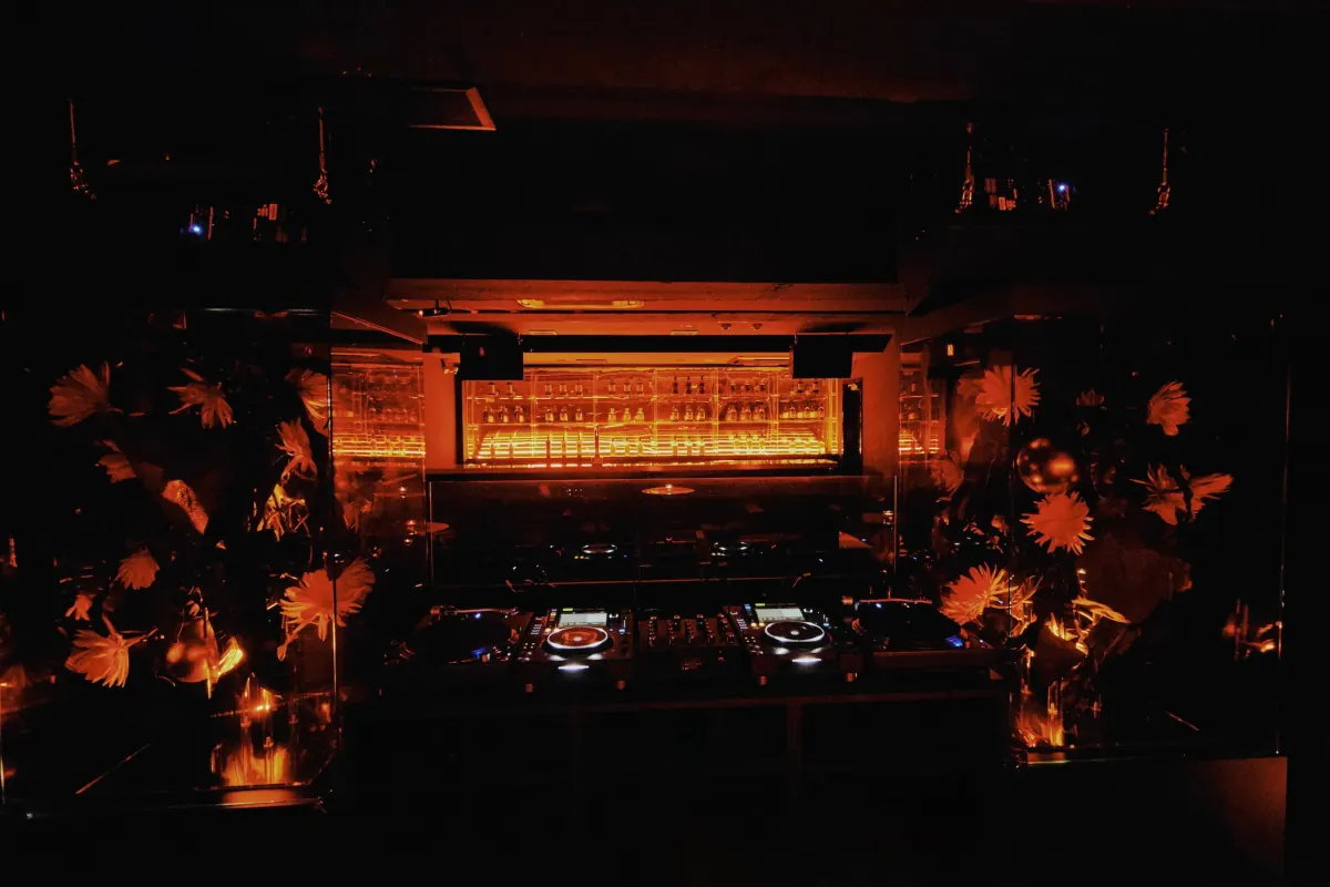 Mitsuki bar and DJ booth framed by flower artwork